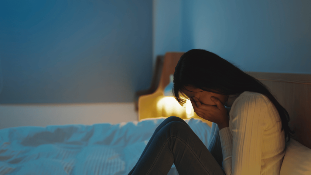 woman crying in room. depression and emotional pain